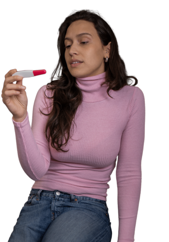 Young women looking at a pregnancy test uncertain.
